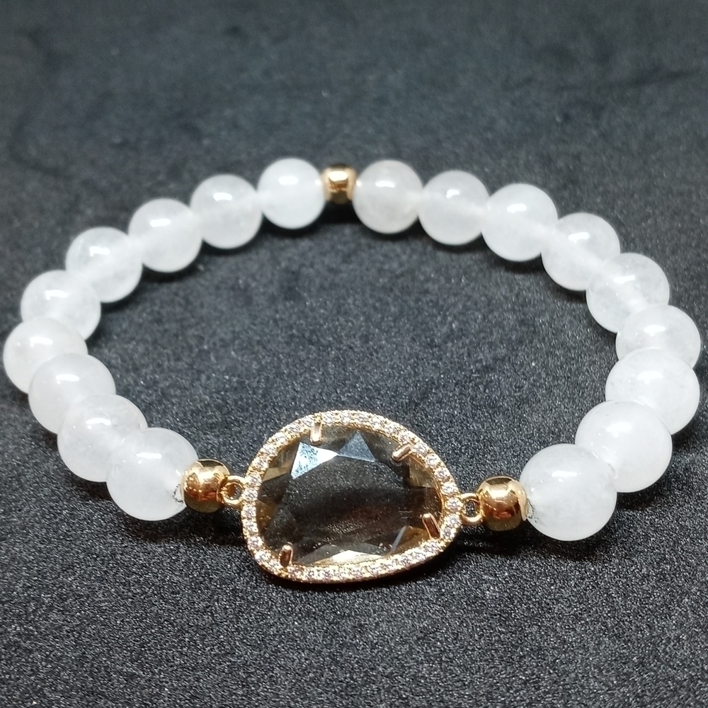 Moonstone bracelet with clear decorative Center and rhinestone accents.